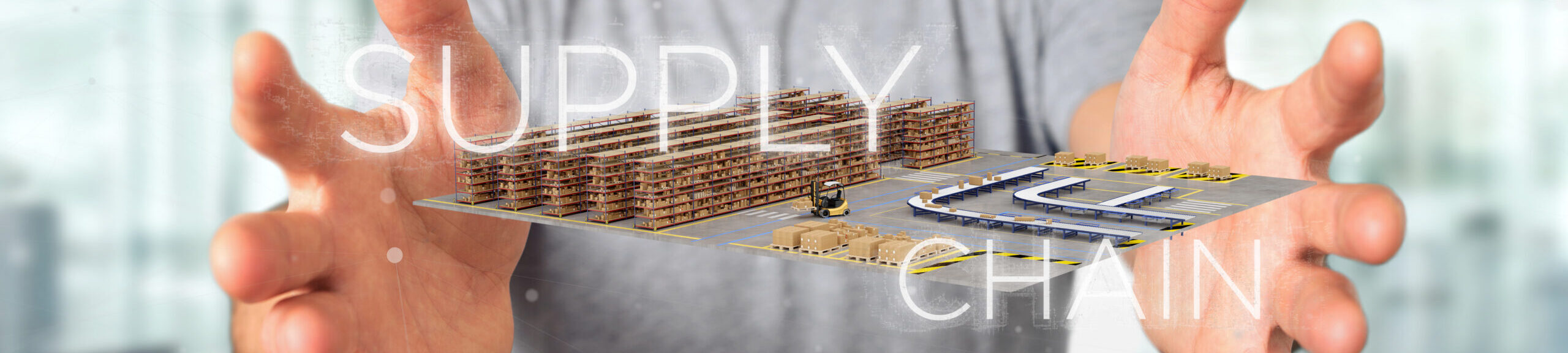 Businessman holding a Supply Chain title with a warehouse on bac